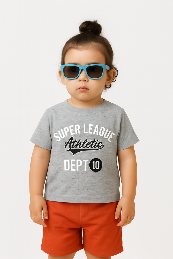 Child wearing a gray t-shirt with 'Super League Athletic Dept 10' text and orange shorts, standing against a white background.